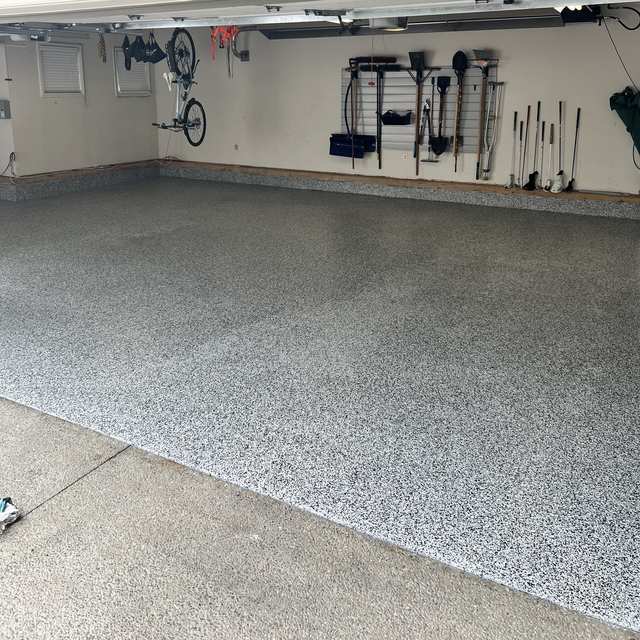 Finished flake floor in a triple garage in Calgary